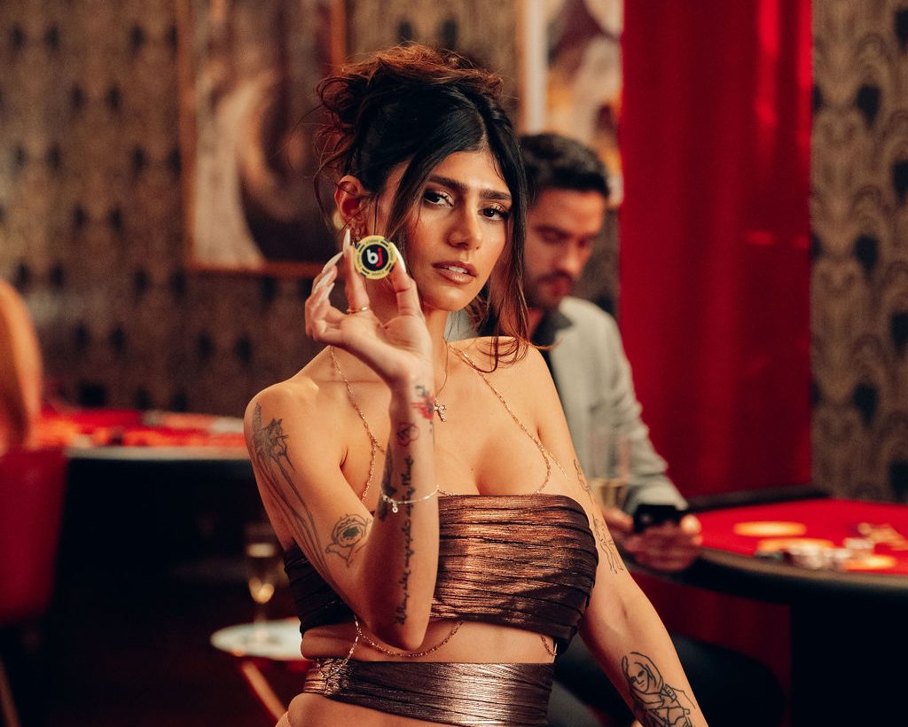 Baji Casino App launch hero still with device UI and motion graphics, featuring Mia Khalifa
