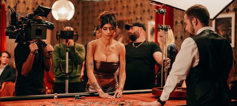 Mia Khalifa playing roulette in Caldera Films casino set recording for casino app BJ commercial.