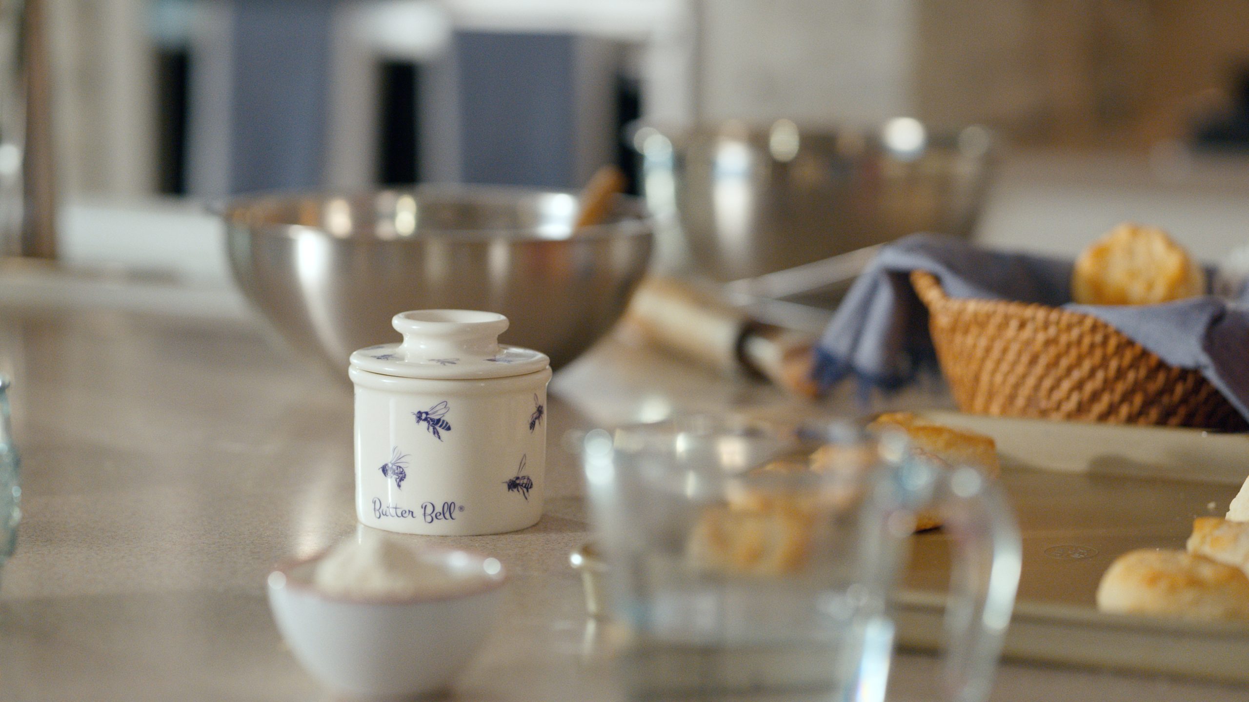 Family brunch table—hands reaching for bread and butter